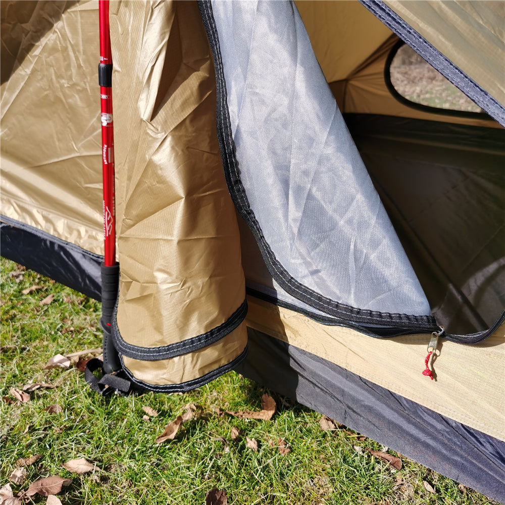 Backpacker emerging from an ultralight A-frame tent in the morning.