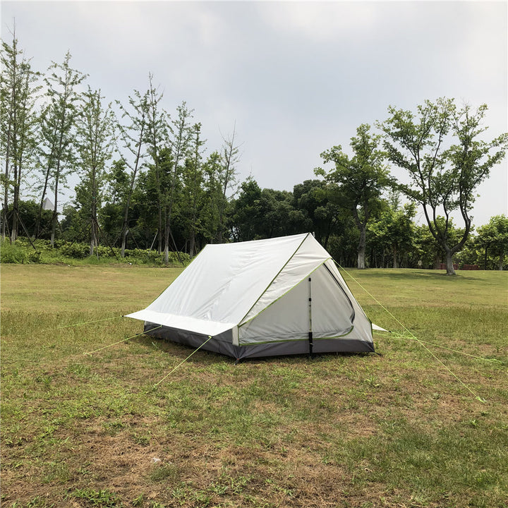 Compact A-frame duo trekking pole tent, packed in a compression sack.