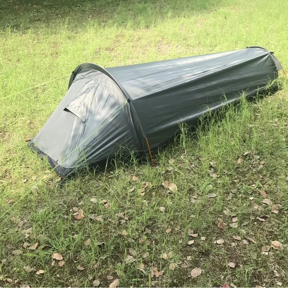 Single person bivy tent under a starry sky, highlighting its use for outdoor camping.