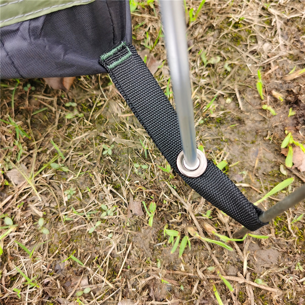 Compact bivy tent set up on varied terrain, demonstrating versatility for camping.