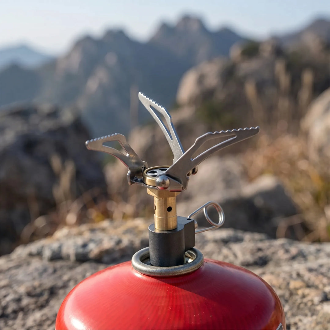 Ultralight folding backpacking gas stove, perfect for compact hiking & outdoor cooking on the go.