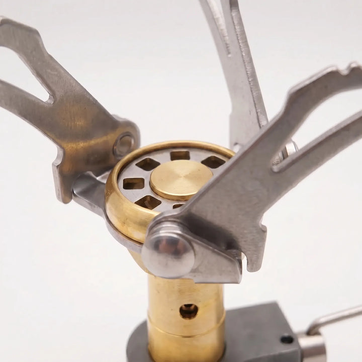 Ultra-compact folding gas stove, ideal for backpacking, camping, and portable outdoor cooking adventures.