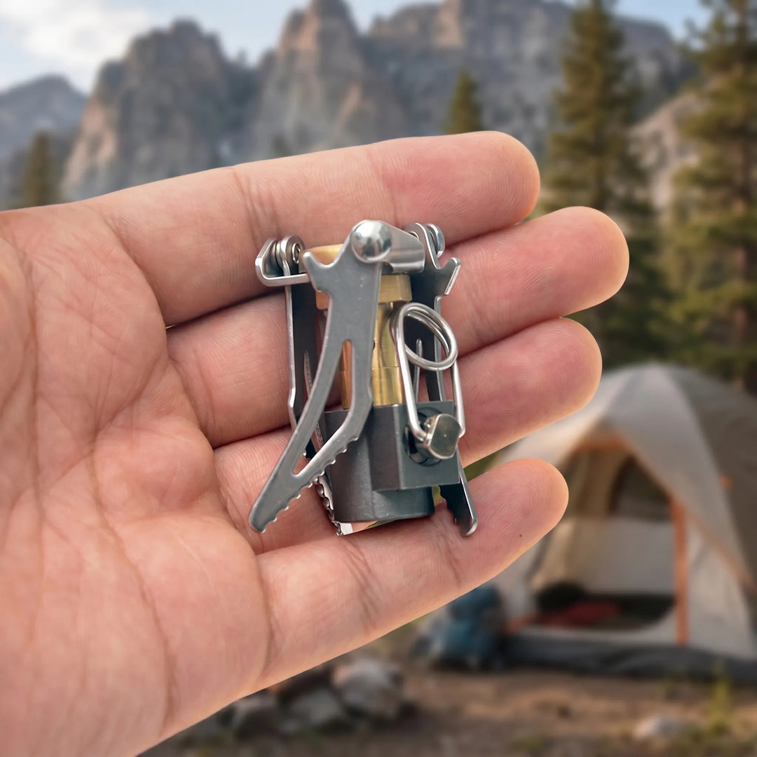 Portable ultralight gas stove, folds for backpacking, camping, and quick outdoor cooking. Essential gear.