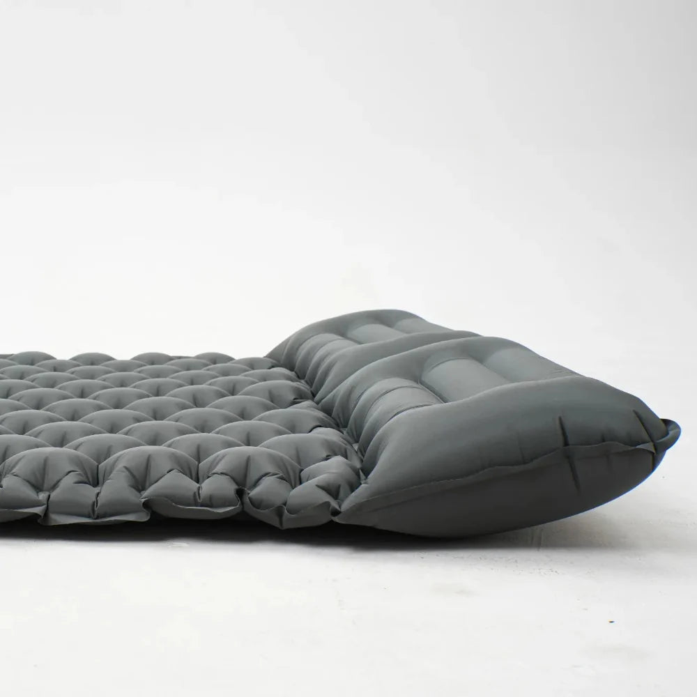 High-angle view of inflated camping mattress, highlighting its thick cushioning.