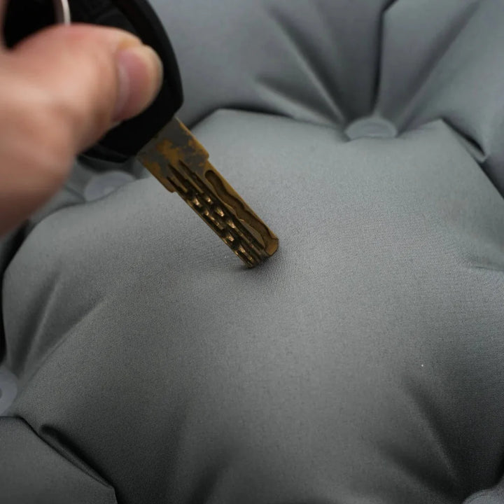 Ultralight sleeping pad on uneven ground, showcasing its durability and versatility.