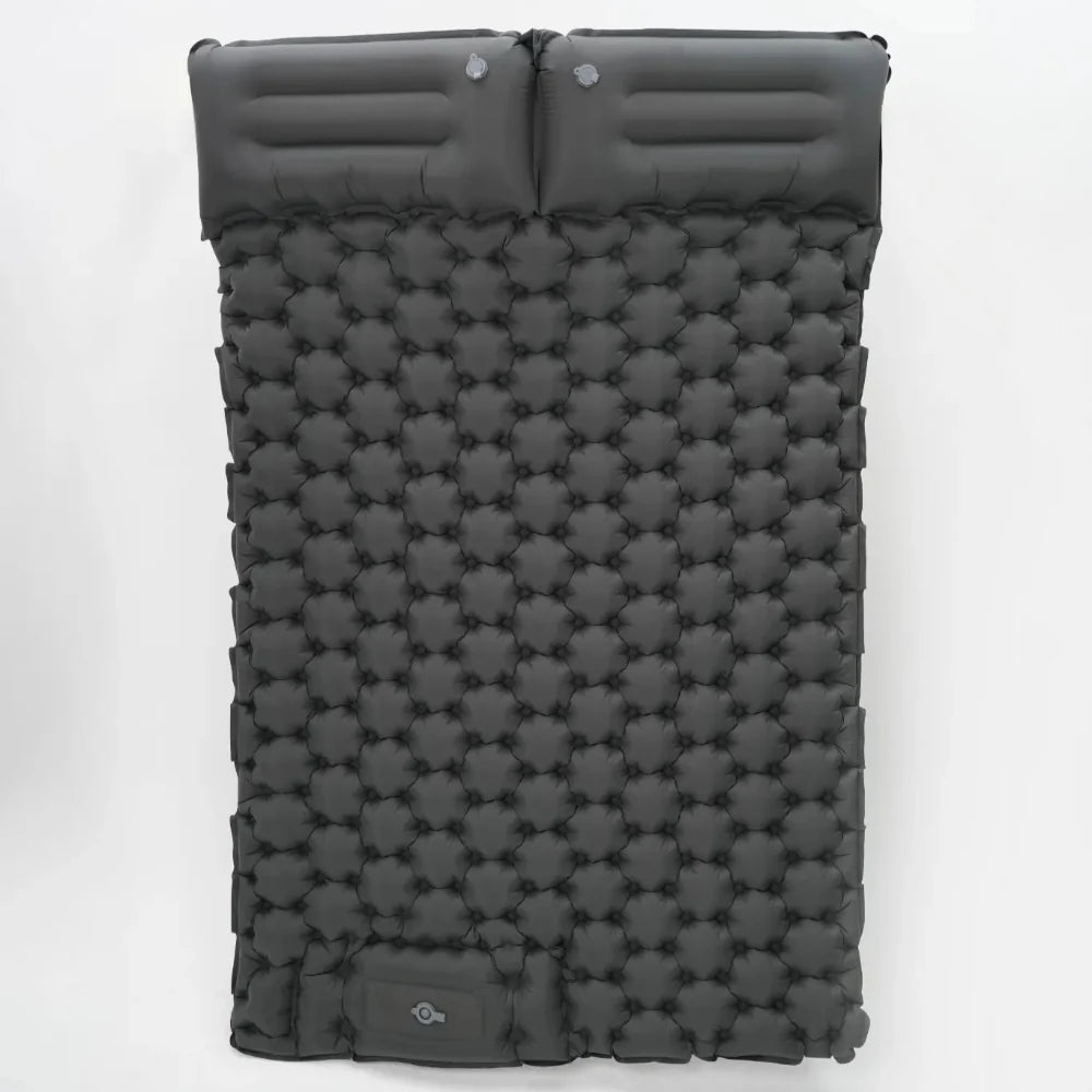 Camping essentials laid out, including the ultralight inflatable mattress and other gear.