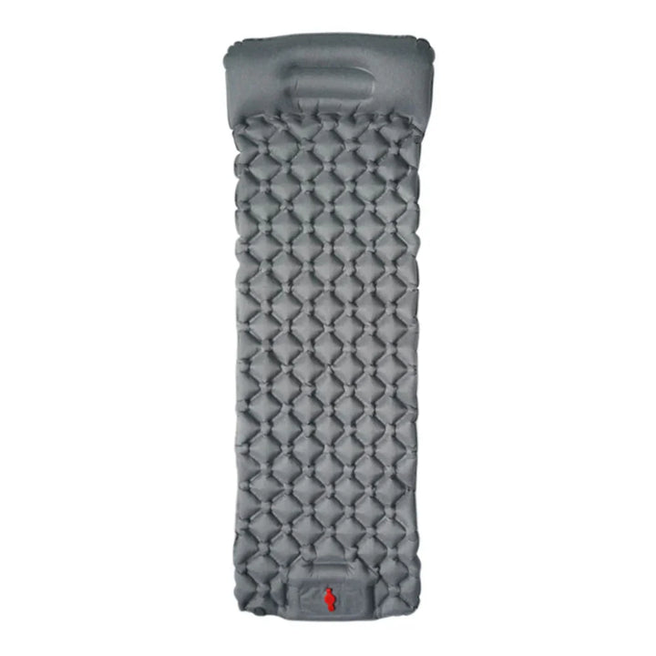 A person easily carrying a packed ultralight camping mattress, emphasizing portability.