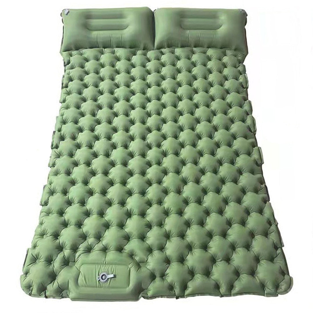 Packed ultralight sleeping pad next to a hiking backpack, essential outdoor gear.
