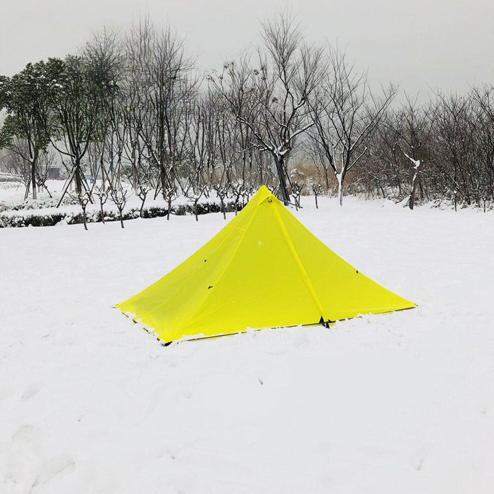 Overview of the ultralight pyramid tent setup, including guy lines for stability.