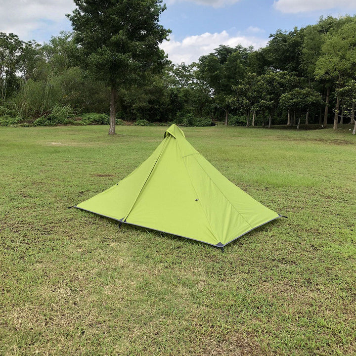 Ultralight 3-season pyramid tent, rolled up and bagged, highlighting its portability.