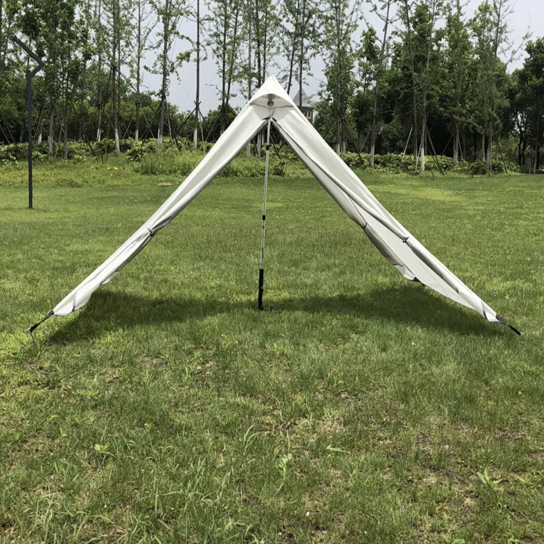 Ultralight pyramid tent in a vibrant color, standing out in a natural outdoor setting.