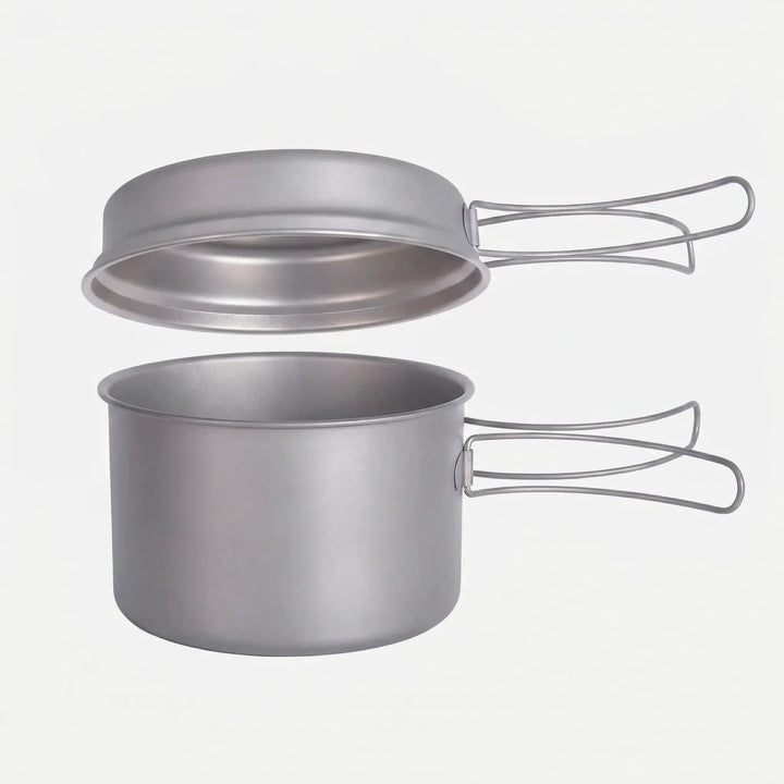 Unisex ultralight titanium cookware set with folding handles for outdoor hiking & camping.