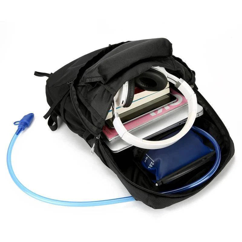 Lightweight 18L packable daypack shown folded into its small pouch, space-saving outdoor gear