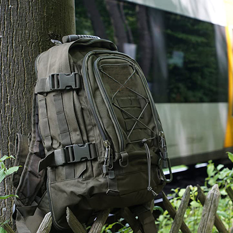 Waterproof 60L tactical backpack in a forest setting, ready for outdoor adventure and hiking