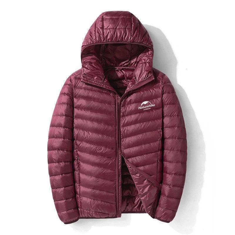 Packable 800FP duck down lightweight jacket, folded neatly, suitable for hiking and travel.