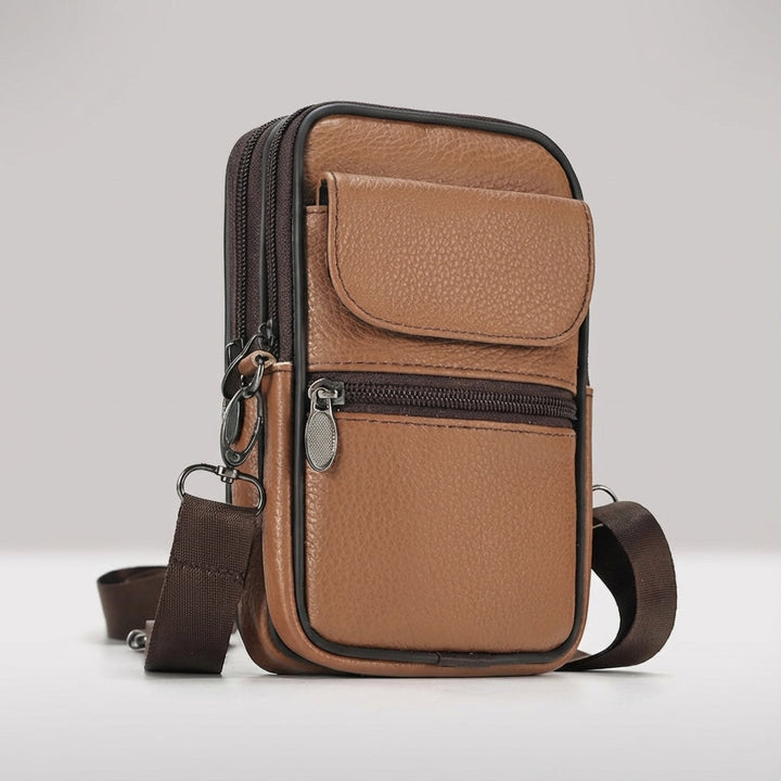 Durable brown leather crossbody bag, perfect for carrying essentials securely on the go.