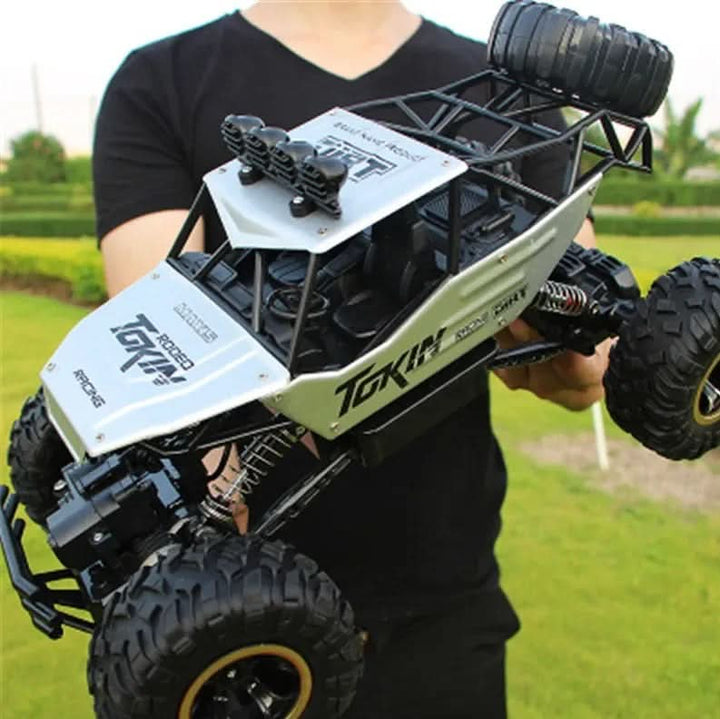 Dynamic shot of a Unisex RC Monster Truck jumping over obstacles, showcasing its agility.