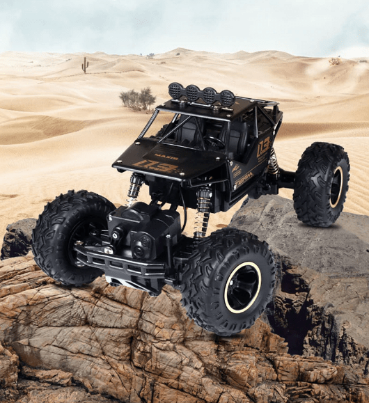 Action shot of an All-Terrain RC Monster Truck speeding across a dirt track, kicking up dust.