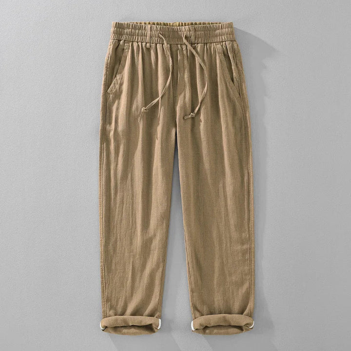 Versatile unisex drawstring pants with a relaxed fit, tapered leg, and rolled hem. Perfect for summer casual wear.