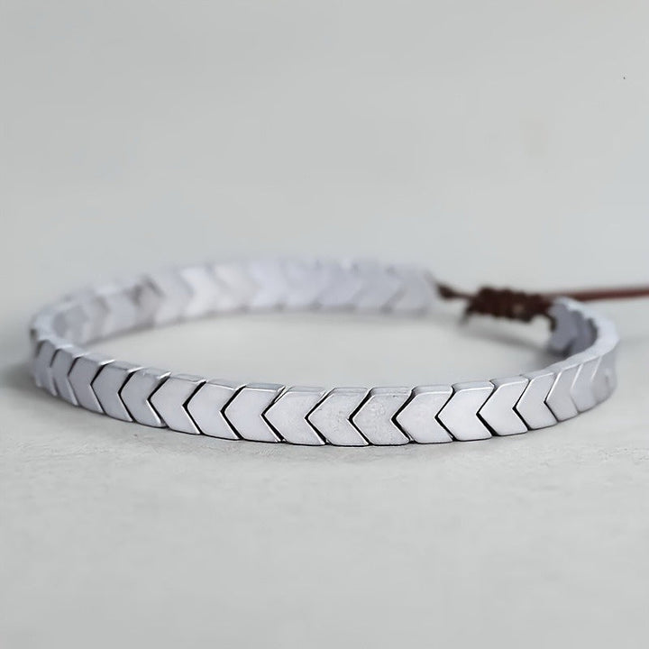 Chevron pattern hematite beaded bracelet, a stylish adjustable unisex accessory with dark grey gemstones.