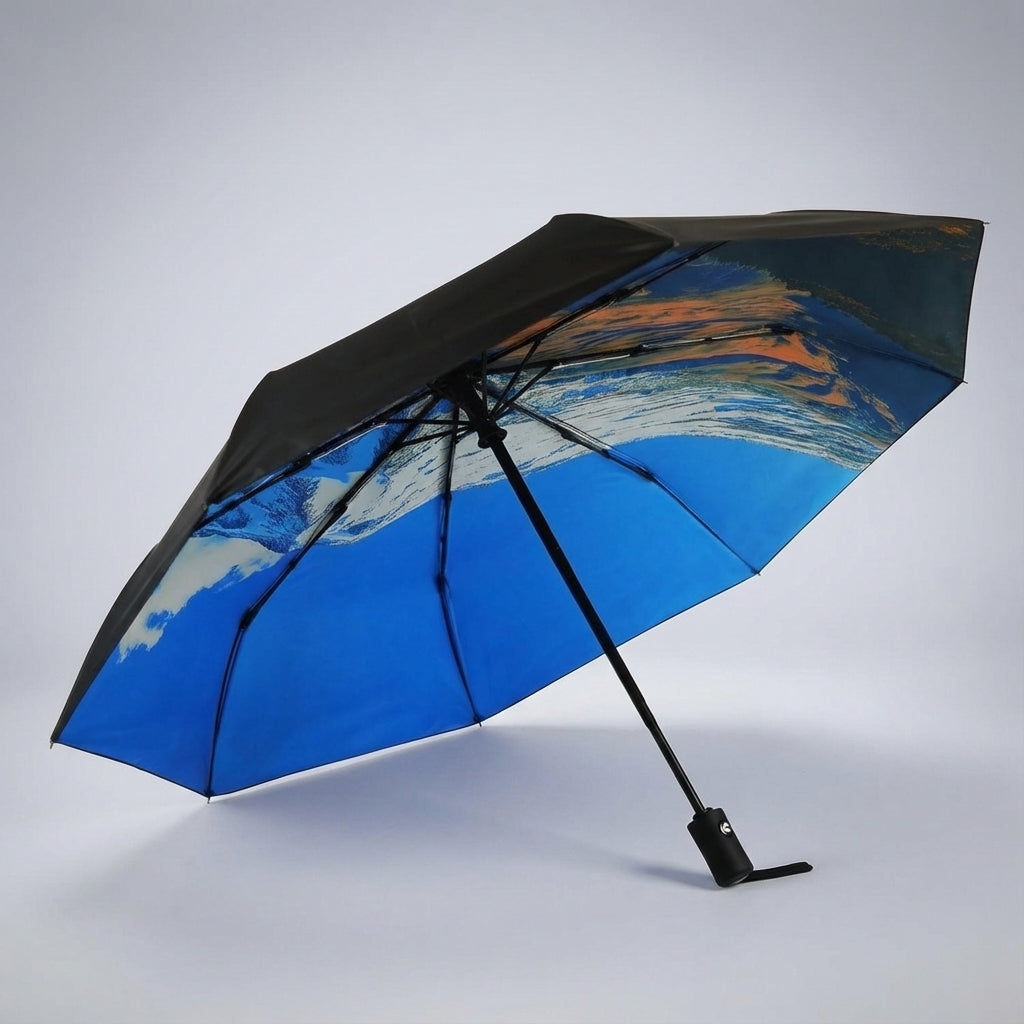 Portable Rainova travel umbrella, folded compactly, perfect for bags & travel convenience.