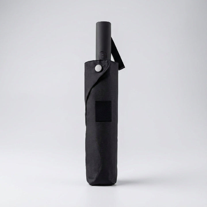 Compact windproof & water-repellent automatic travel umbrella, essential portable rain gear for outdoor adventures.