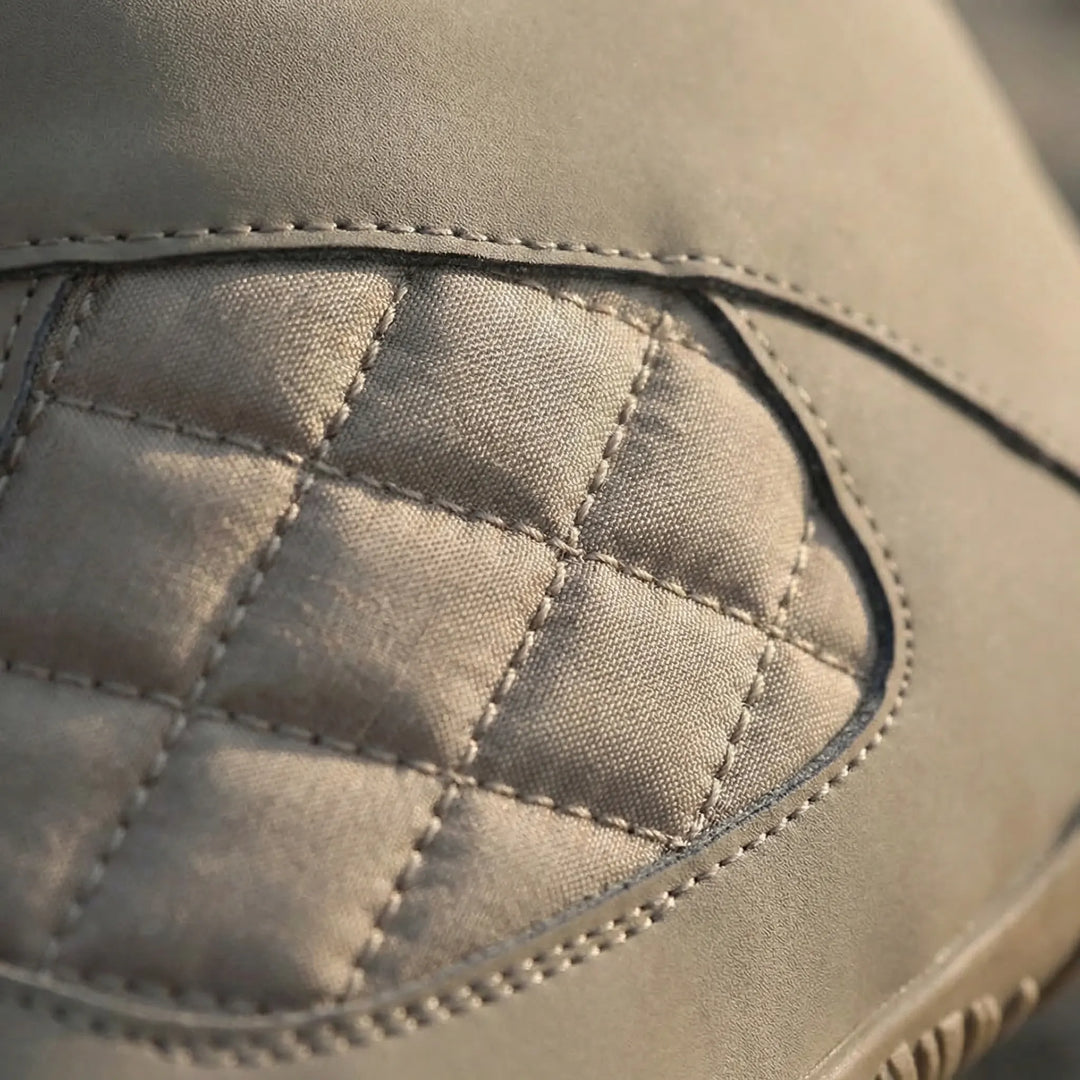 Close-up of black unisex barefoot winter ankle boots with fleece lining. Designed for natural feel & warmth.