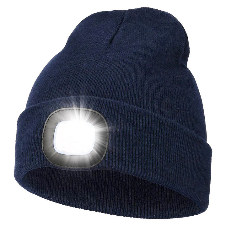 Hand holding a lightweight USB rechargeable LED beanie, emphasizing its portability and design.