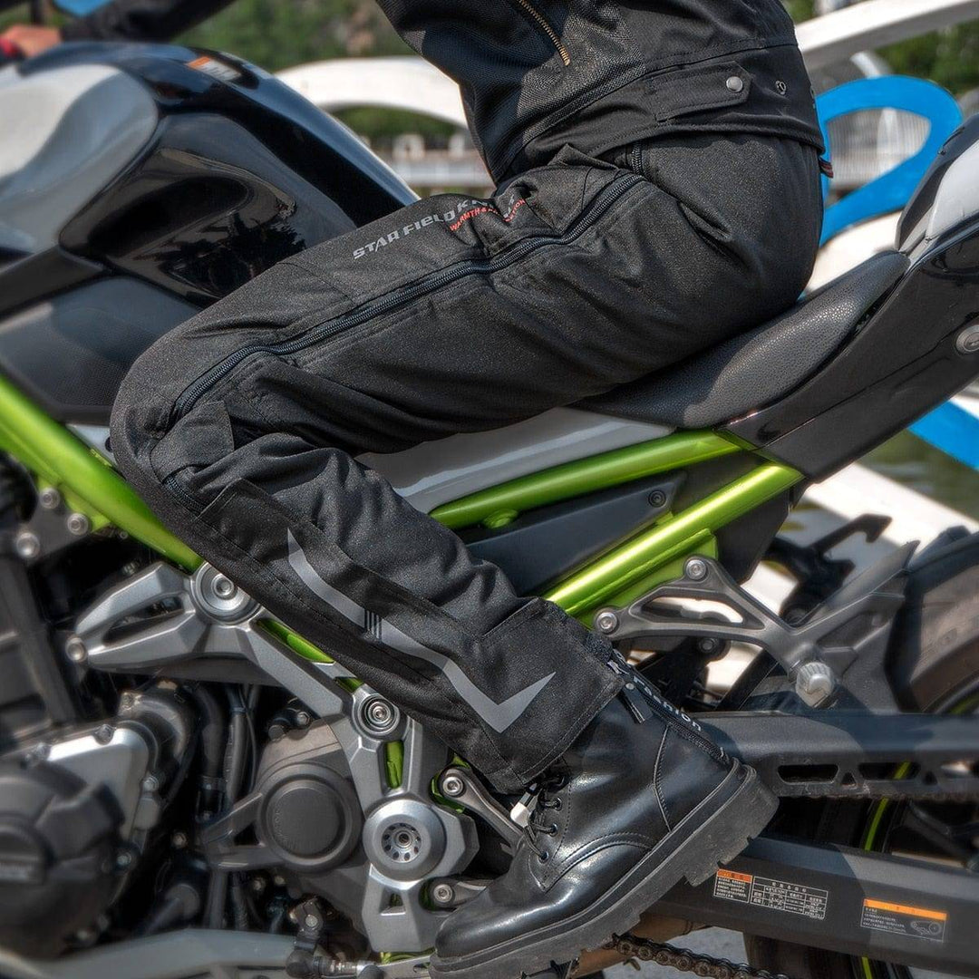 Unisex windproof cargo pants for motorcycle riding, featuring multiple pockets and reflective design for visibility.