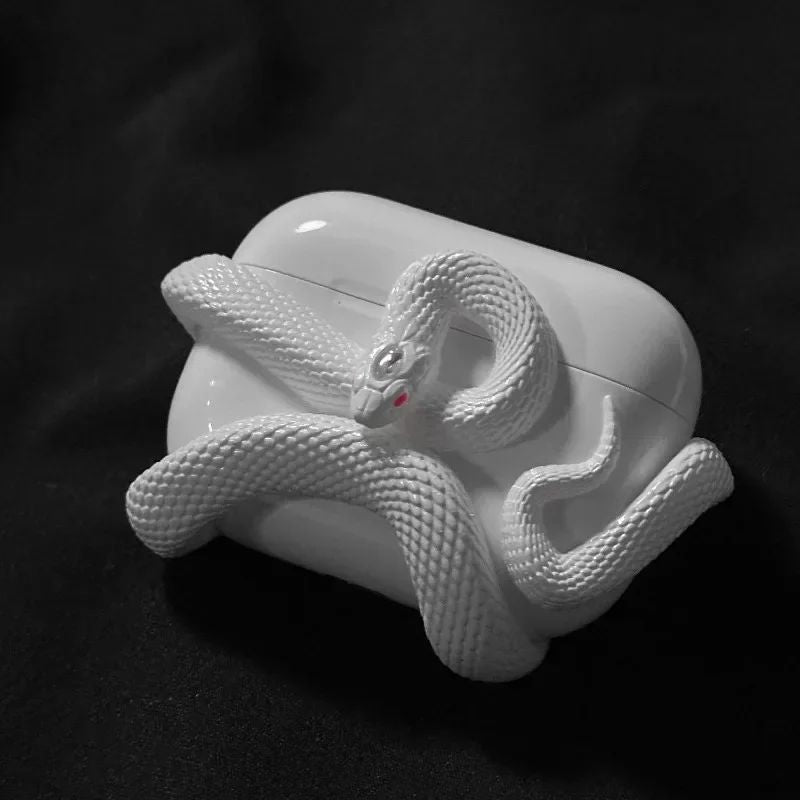 Protective wireless earbud cover in black with a unique serpent design, a stylish tech accessory.