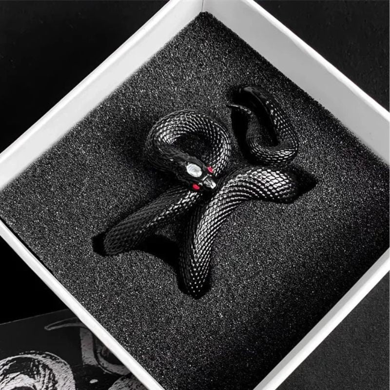 Unisex serpent design earbud charging case in pink silicone, provides scratch-resistant protection.