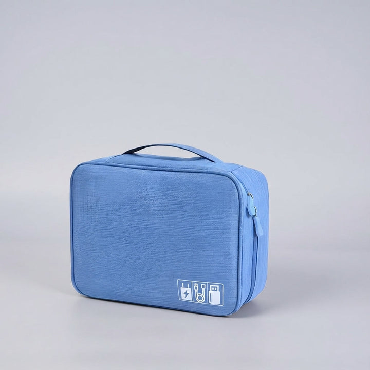 Efficient travel accessory organizer bag for securing gadgets, cables, and small electronics.