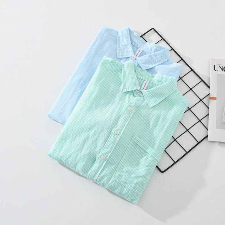 Casual striped button-up shirt in blue for men & women, ideal for comfortable summer outfits.