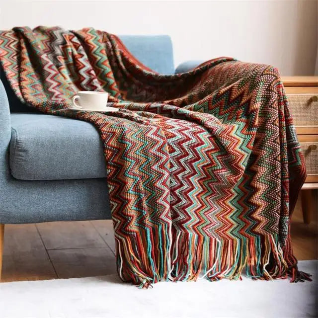 Textured boho striped throw blanket with playful tassels, an inviting soft blanket.