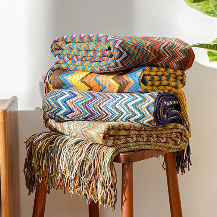 Striped boho throw blanket with tassels. A soft, cozy accent for living room or bedroom.