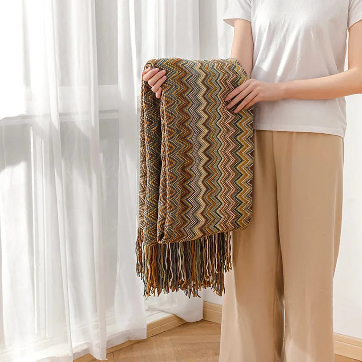 Super soft boho striped throw blanket with tassels, a cozy addition to your bedroom.