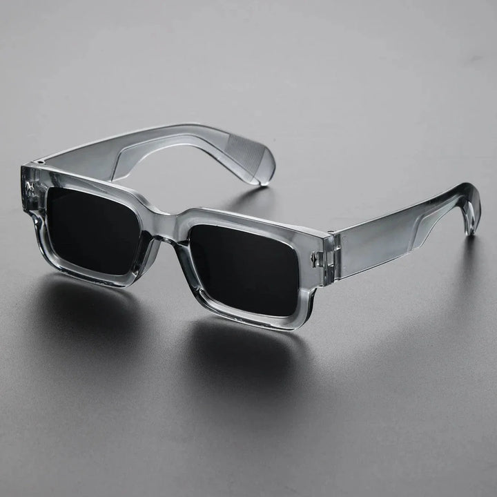 Unisex bold rectangular sunglasses with UV protection. Black translucent frames, lightweight fashion eyewear for any look.