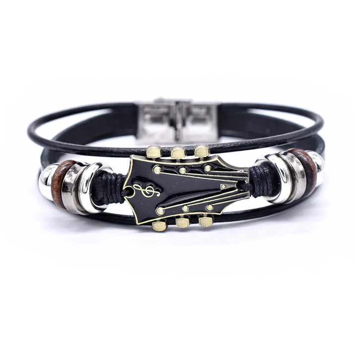 Unisex braided leather bracelet with a detailed silver guitar charm, perfect music lover's jewelry accessory.