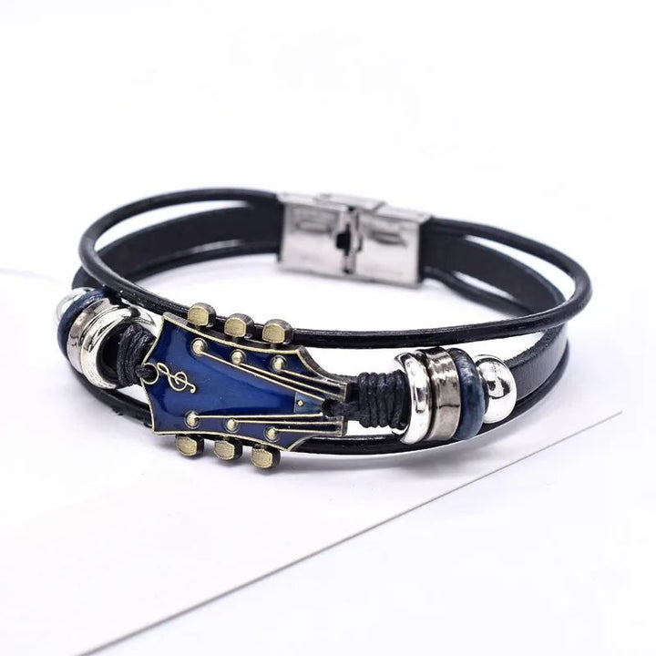 Dark braided genuine leather bracelet featuring a detailed guitar pendant, ideal accessory for musicians & fans.