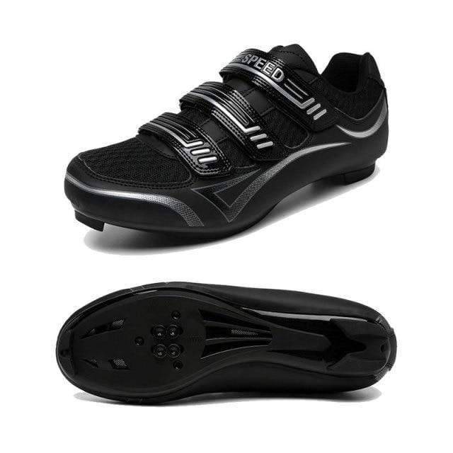Unisex road cycling shoes, lightweight and breathable, sitting on a wooden floor
