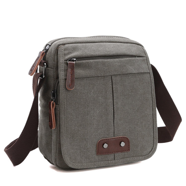 Stylish canvas crossbody bag for men & women. Features multiple compartments, ideal as an everyday or travel shoulder bag.