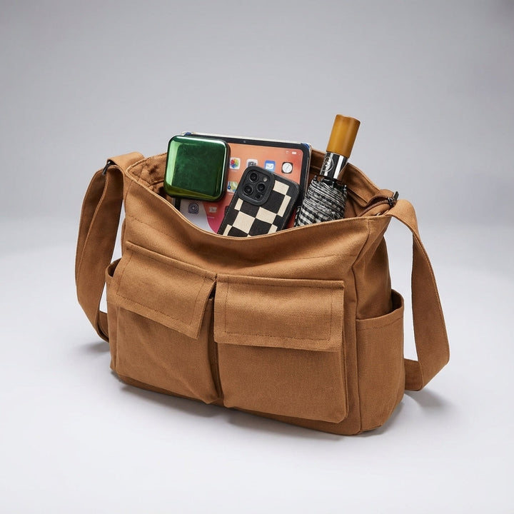 Stylish canvas messenger bag, unisex crossbody design for daily carry, travel, and versatile use.