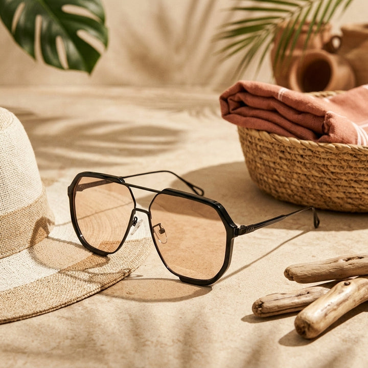 Front view of classic unisex aviator sunglasses, highlighting the sleek metal frame & dark lenses.