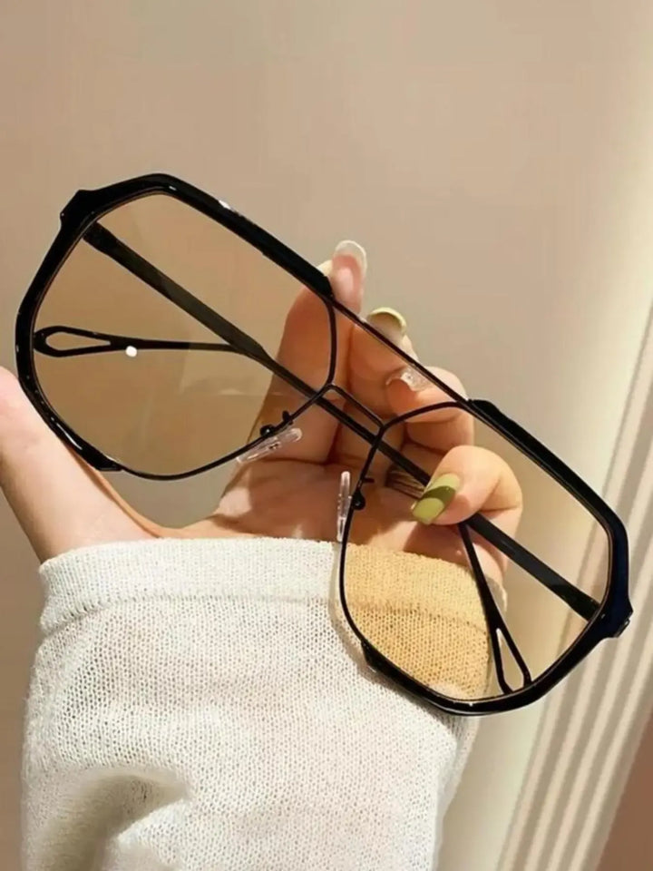 Classic aviator sunglasses, a perfect fashion accessory for men & women, with sleek metal frame.