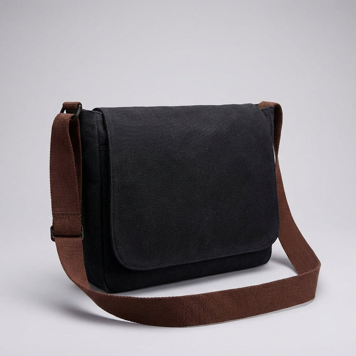 Classic unisex canvas messenger bag, black, perfect for laptop, school, or work. A versatile & durable crossbody bag.