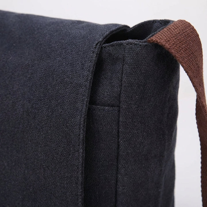 Durable black canvas messenger bag for men & women. Ideal everyday shoulder bag, perfect for travel or laptop.