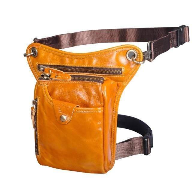 Close-up of antique brass hardware on a classic unisex leather shoulder bag/waist pack