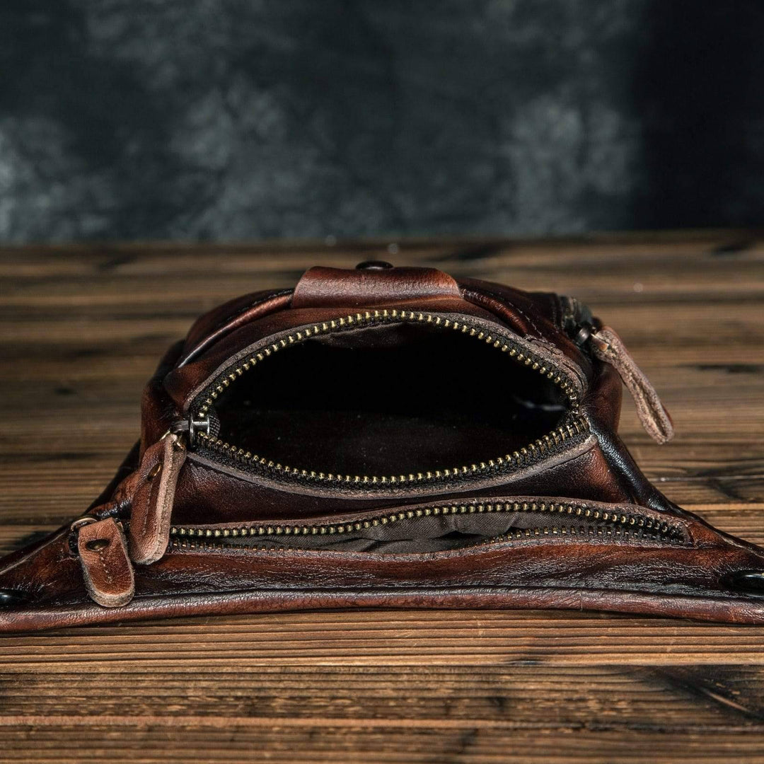 Close-up of genuine cowhide texture on classic unisex leather shoulder bag/waist pack