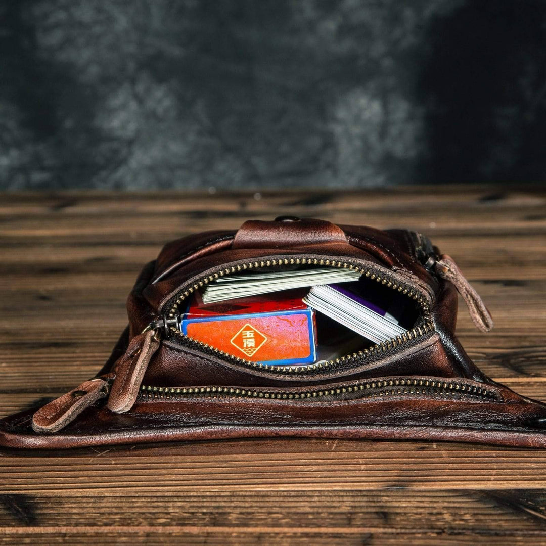 Unisex leather sling bag with adjustable strap, comfortable brown cowhide shoulder pack