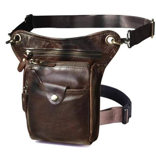 Model wearing classic brown genuine leather sling bag, ideal for outdoor adventures